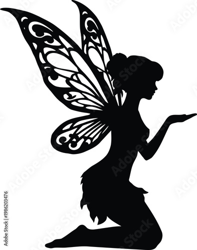 Silhouette of a fairy with intricate wings kneeling and holding an object