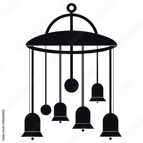 A silhouette of a wind-chime hanging static 