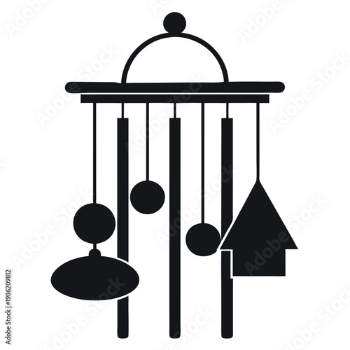 A silhouette of a wind-chime hanging static 