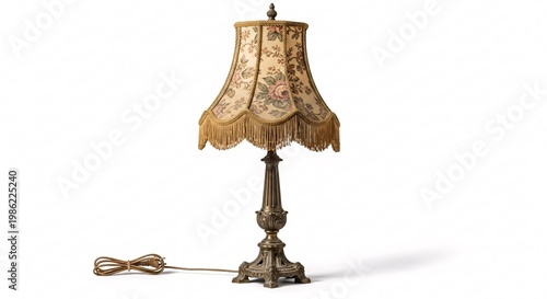 Vintage table lamp with patterned lampshade isolated on white background
