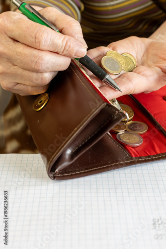 hand counting euros in wallet and copy space