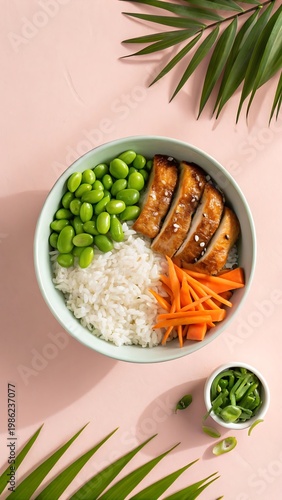 Healthy salmon poke bowl with edamame rice and carrots