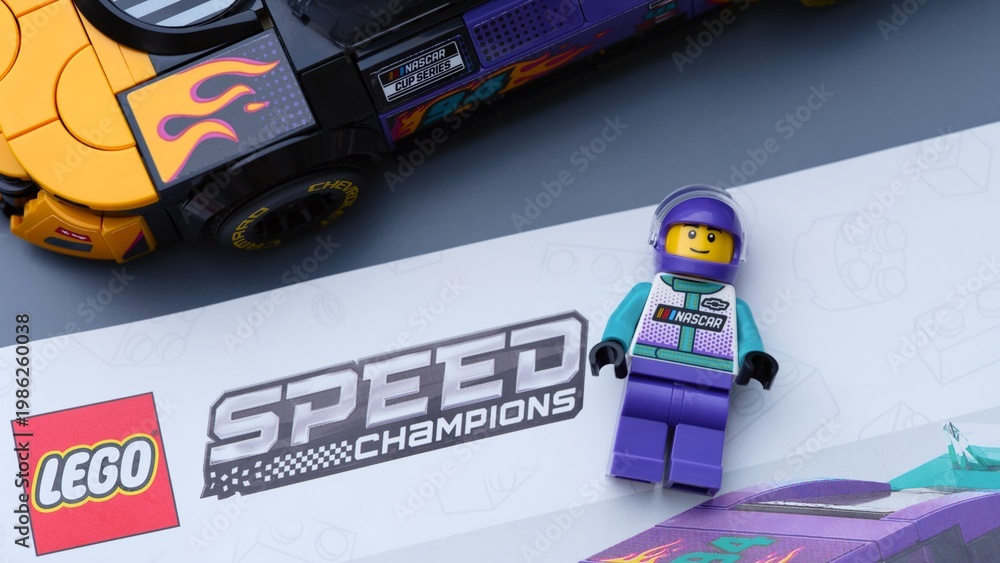 Fototapeta premium Tambov, Russian Federation - January 04, 2026 Lego Speed Champions kit with nstruction book, driver minifigure and Nascar Next Gen Chevrolet Camaro car. Close-up