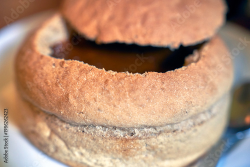 Traditional goulash soup in fresh bread