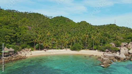 Soothing Coastal Landscape Showcasing Pristine Shallow Waters And Verdant Hills Under Bright Clear Sky