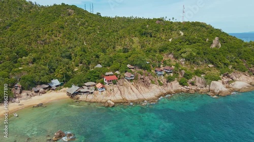 Scenic Aerial Perspective Of Vibrant Hamlet Perched On Cliff With Lush Greenery And Clear Ocean