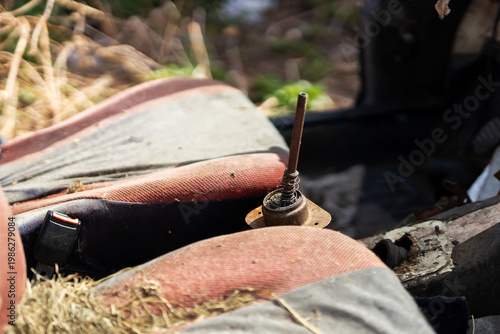 Aged car with weathered fittings. Vehicle interior showing signs of longterm decay