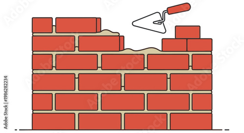 Bricklayer building a wall with mortar and a metal trowel