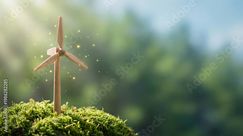 Horizontal Web Banner with Wooden Wind Turbine Model on Green Moss for Renewable Energy, Sustainability, and Environmental Protection Concept