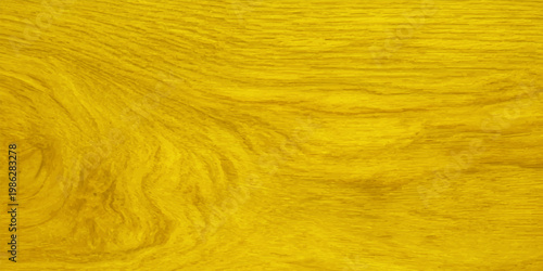Bright yellow wood grain texture background with natural wavy patterns and golden hues