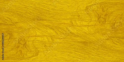 Bright yellow wood grain texture background with natural wavy patterns and golden hues