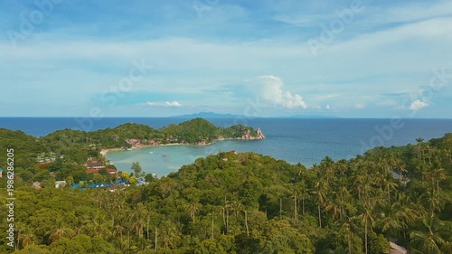 Tranquil Bay With Lush Palms. Scenic Outlook Of Koh Tao Harbor Surrounded By Greenery And Calm Sea