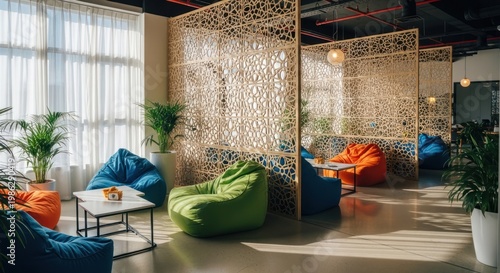 Modern office relaxation area with beanbag chairs and decorative screens
