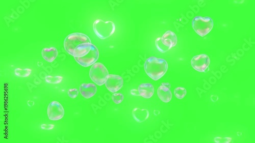 A colorful video of iridescent bubbles floating on a bright green background