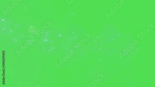 A video showcasing a mesmerizing display of sparkling lights on a vibrant green background