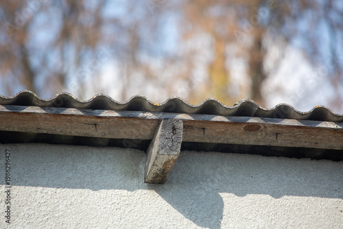 Konstfotografi Close-Up of Corrugated Roof Edge with Wooden Beam