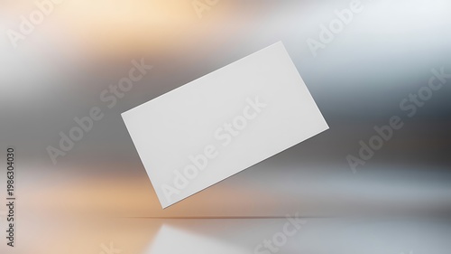 Blank white business card floating on reflective surface with blurred colorful background for branding and design