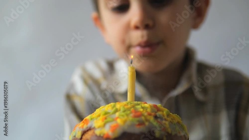 Super Slow Motion Boy Blowing Out Birthday Cake Candle with Flame Extinguishing and Smoke Rising — Childhood Celebration Wish and Milestone Concept