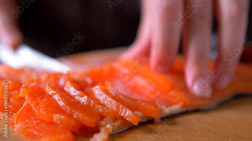 Chef Slicing Fresh Salmon on Wooden Board, Culinary Preparation of Raw Seafood for Sushi and Healthy Meals