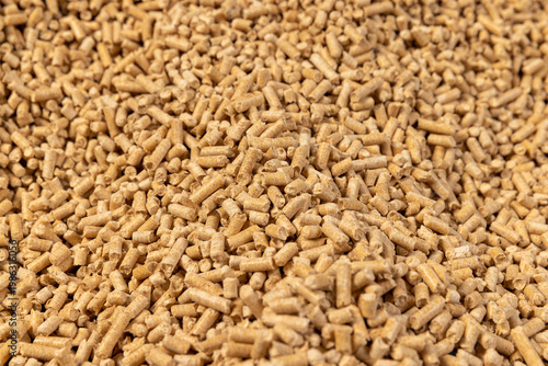 a large number of cylindrical fuel pellets made from sawdust of spruce or pine trees, the pellets are used both for indoor heating and for bedding for pets, wood pellets