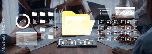 Foto Engaging team meeting in a modern office featuring digital file management, data visualization, and active collaboration with technology tools and vibrant graphics