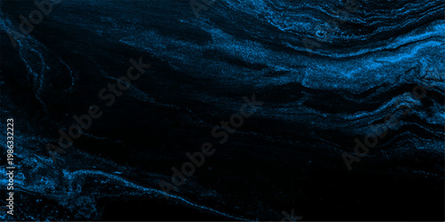 Abstract ocean-like texture of dark blue liquid and ink, blending for a stunning visual effect with depth.