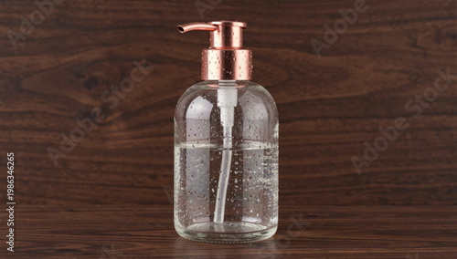 A transparent glass bottle filled with a clear liquid, often used as a decorative or scientific prop