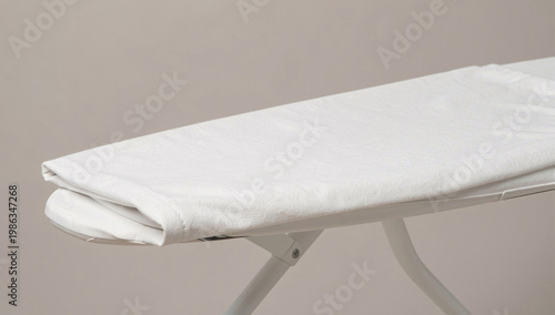 Wallpaper Mural A white ironing board sits on a table, ready for use Torontodigital.ca