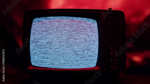 Retro TV, vintage television In a nostalgic setup, a retro TV displays grain on screen, scary halloween night device good for chroma key and green screen.