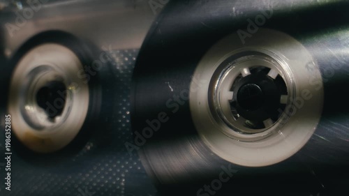 Retro radio tape recorder, audio cassette close-up. Listening to music, old radio boom box player, macro of vintage music listening. 