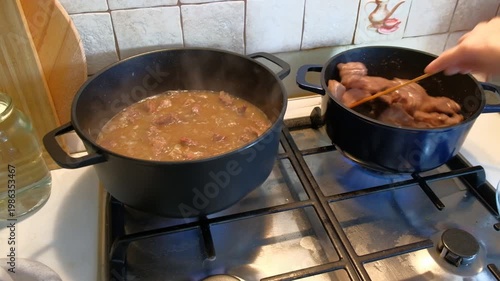 The process of cooking meat, stewing, human hands, women, product, gas stove, pieces of meat Cooking meat stew 2