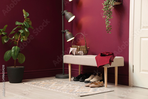 Fotografia Shoe storage. Different stylish footwear under bench indoors