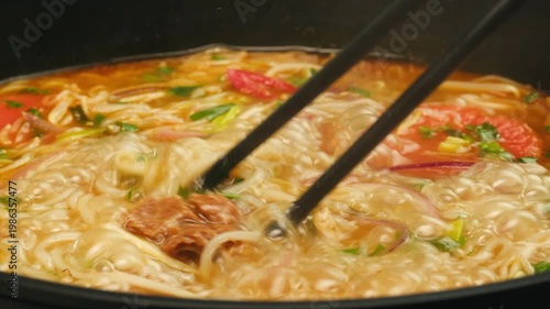 Vietnam traditional pho bo soup on delivery, Beef noodles. Pho Bo Soup with beef, rice noodles, ginger, lime, chili pepper in bowl. Vietnamese cuisine. Pho Noodle Soup restaurant Close-up.