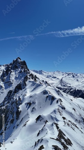 Aerial view of snowcapped  hills  of French alps by winter