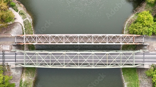 Aerial view of bridge over river oxbow with lush green landscape