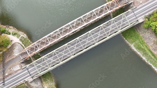 Aerial view of bridge over river oxbow with lush green landscape