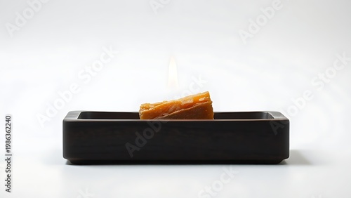 tolerable. Raw frankincense resin burning on dark wood, thin gray smoke rising. event programs, museum guides, designed for cultural heritage projects and event programs, used by interior designers.