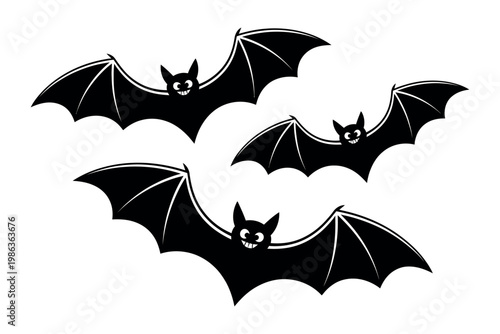 Four black bats fly together creating a spooky Halloween atmosphere.