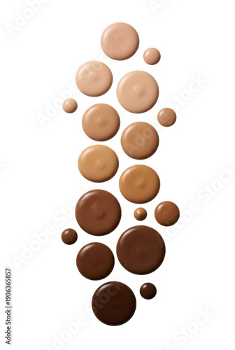 Foto Foundation drops in various skin tones top view isolated