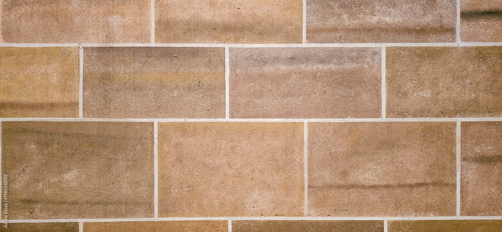 Fototapeta premium Brown Rectangular Stone Tile Wall Texture With White Grout Lines Rustic Background