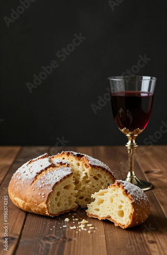 Bread with a crust and a glass of red wine sit on a wooden table. Both are part of a ritual during a religious event, showing tradition and connection Generative AI