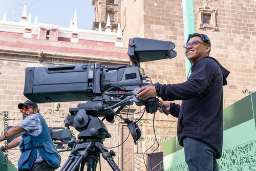 Camera operator filming live television broadcast production