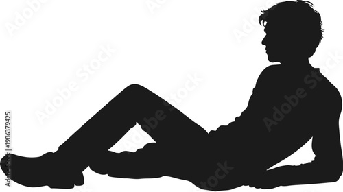 Full length silhouette of a young man lying down, casually reclining and relaxing on the ground.