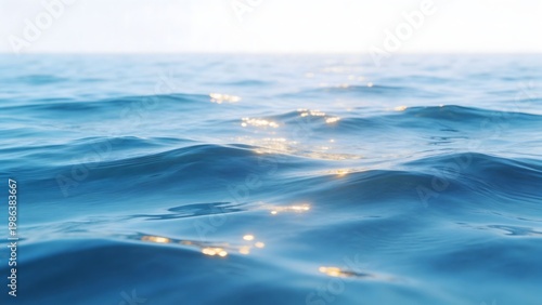 Blue ocean waves with sunlight reflection