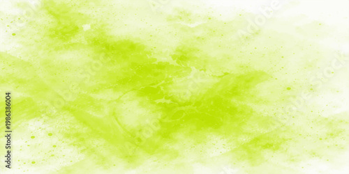 Soft abstract green and yellow watercolor background with a bright sunny bokeh texture featuring blurred spring grass and summer leaf patterns on grunge paper art