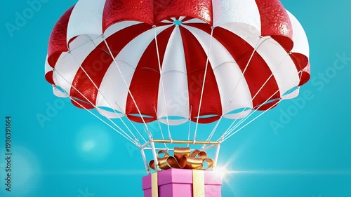 Bright red and white striped parachute carrying a pink gift box against a vibrant blue sky