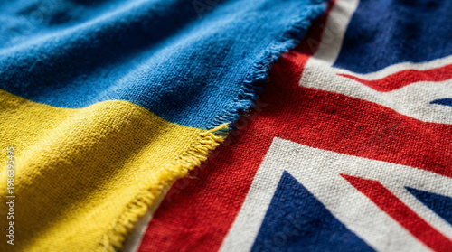 Ukraine and United Kingdom flags with textured cloth, close-up of British and Ukrainian national symbols during war and alliance