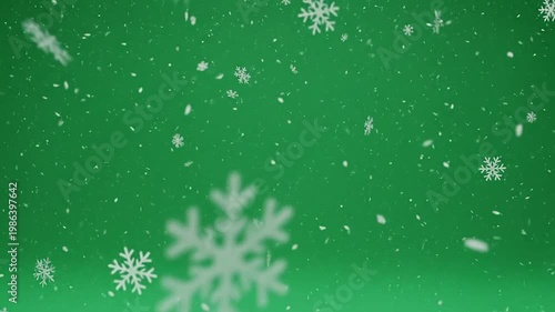 Falling snowflakes on a vibrant green background, perfect for winter holiday season celebrations