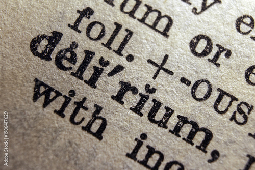 Canvas Print Word delirium printed on dictionary page, macro close up