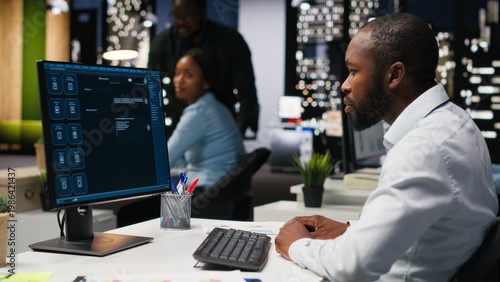 Konstfotografi Male PC user interacting with AI chat system on computer at office after hours, highlighting the evolution of artificial intelligence